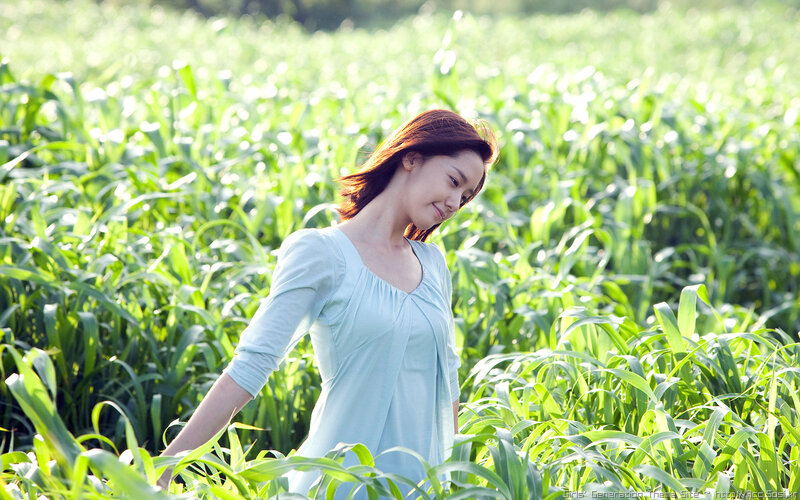 woman in a green field