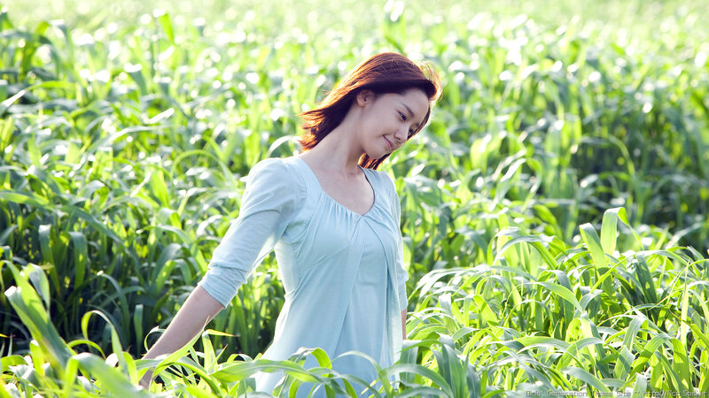 woman in a green field