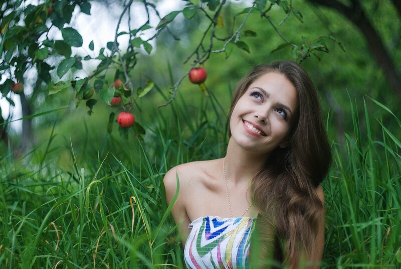 Woman in a green garden