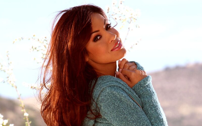 woman in a green sweater