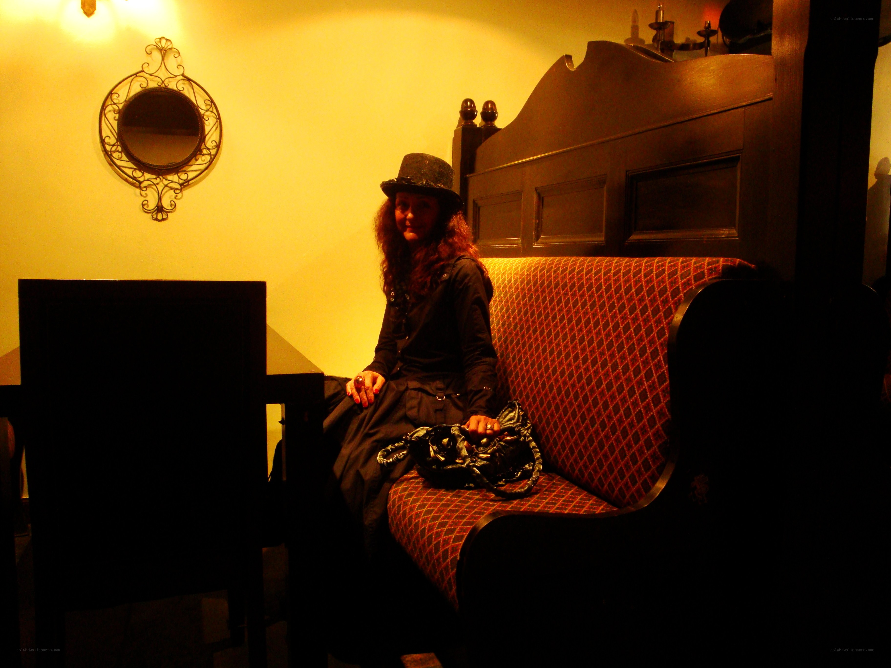Woman in a hat on a bench