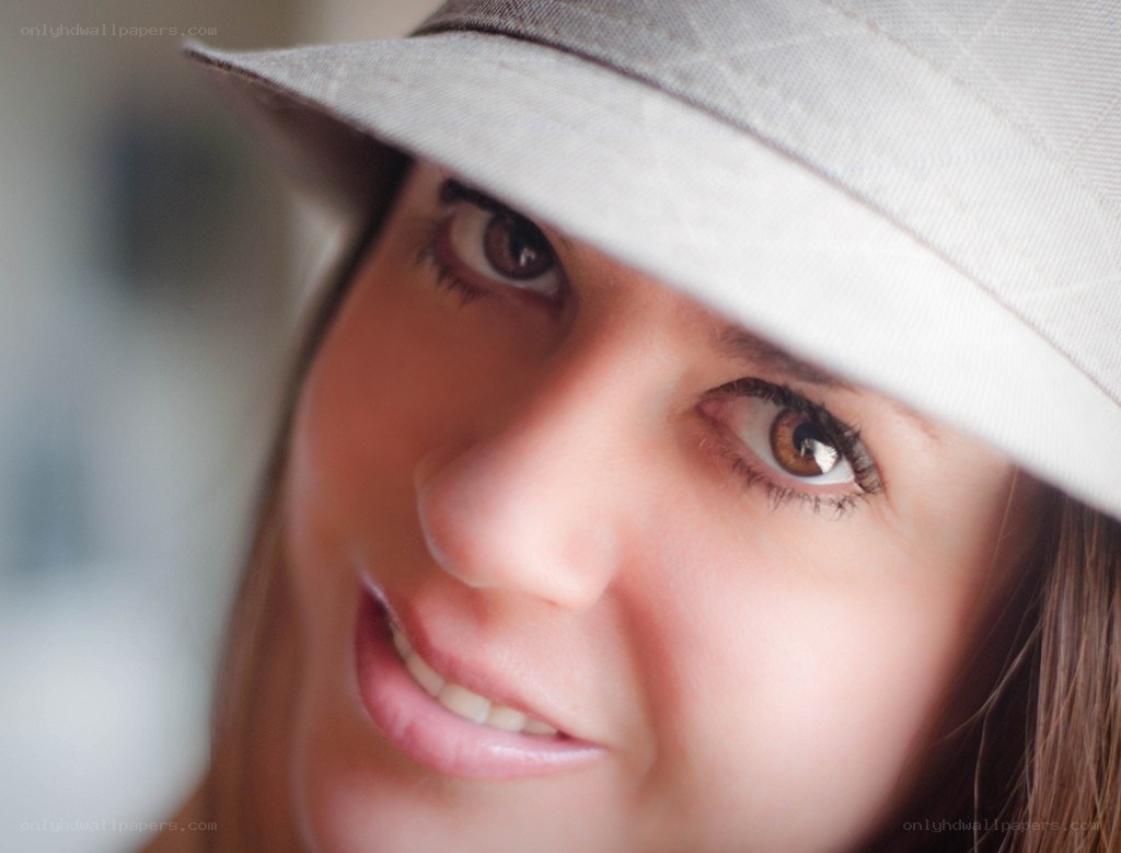 woman in a hat smiling