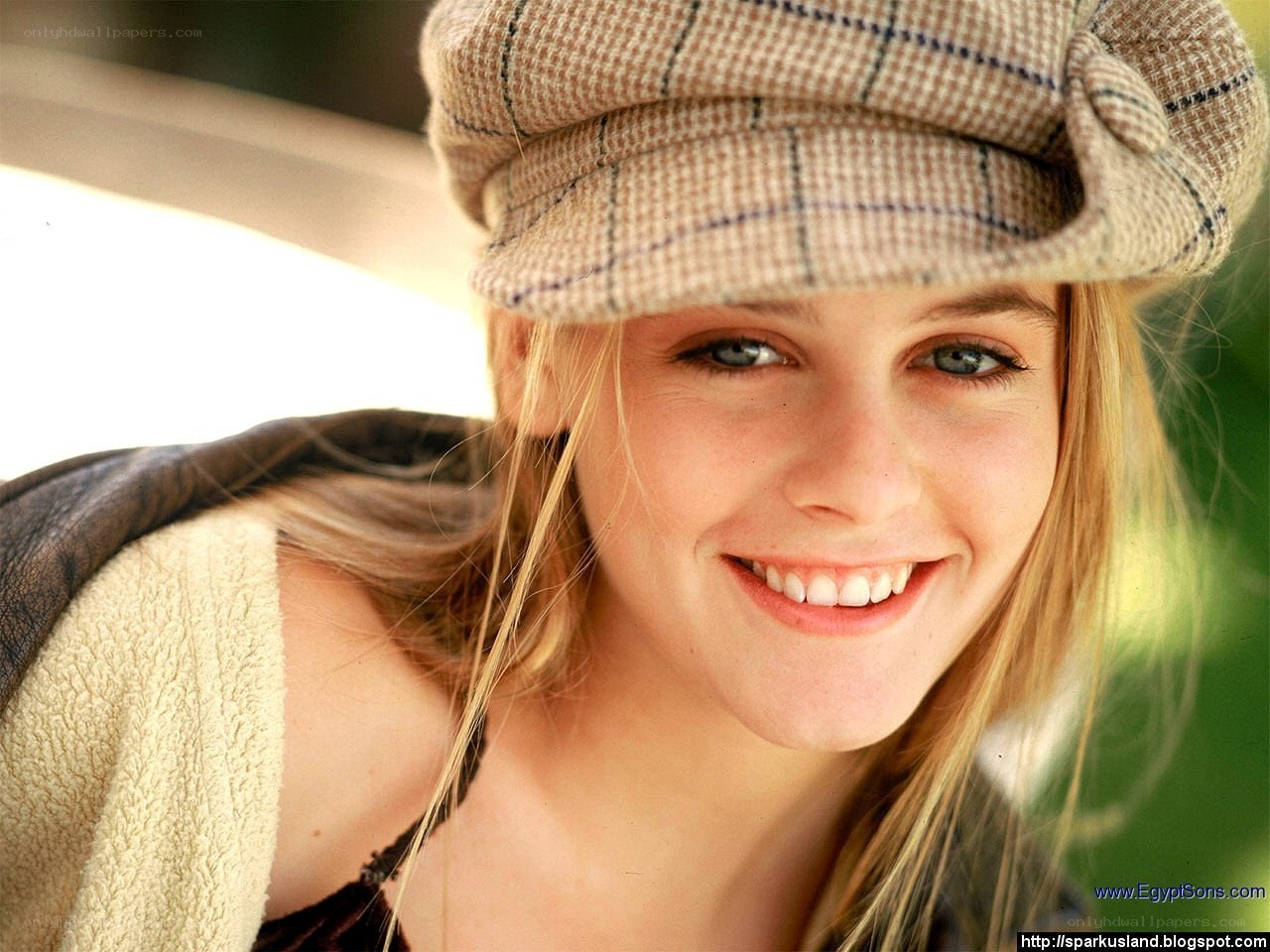 woman in a hat smiling