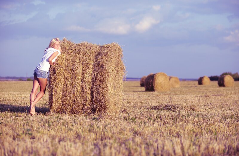 Woman in a hayfield