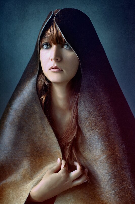 woman in a hooded cloak