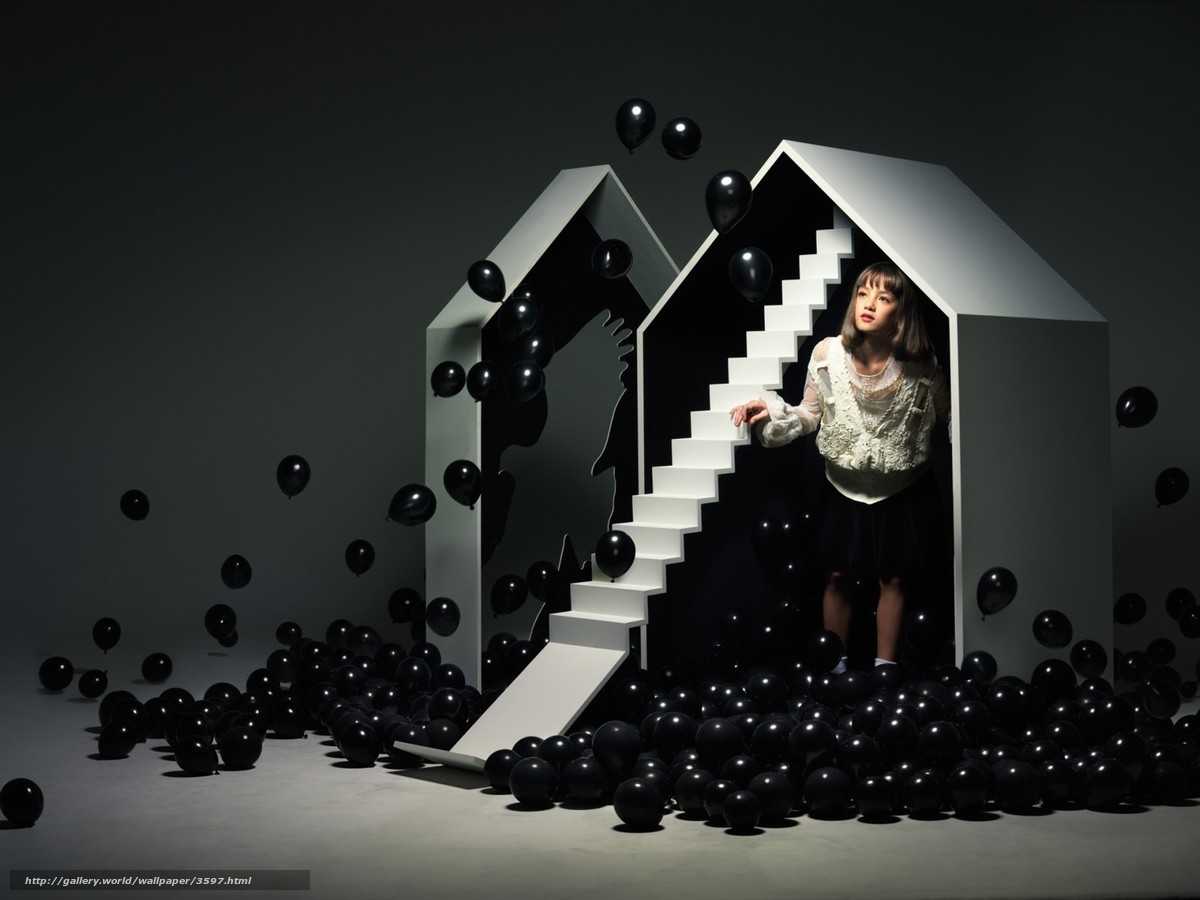 woman in a house of black balloons