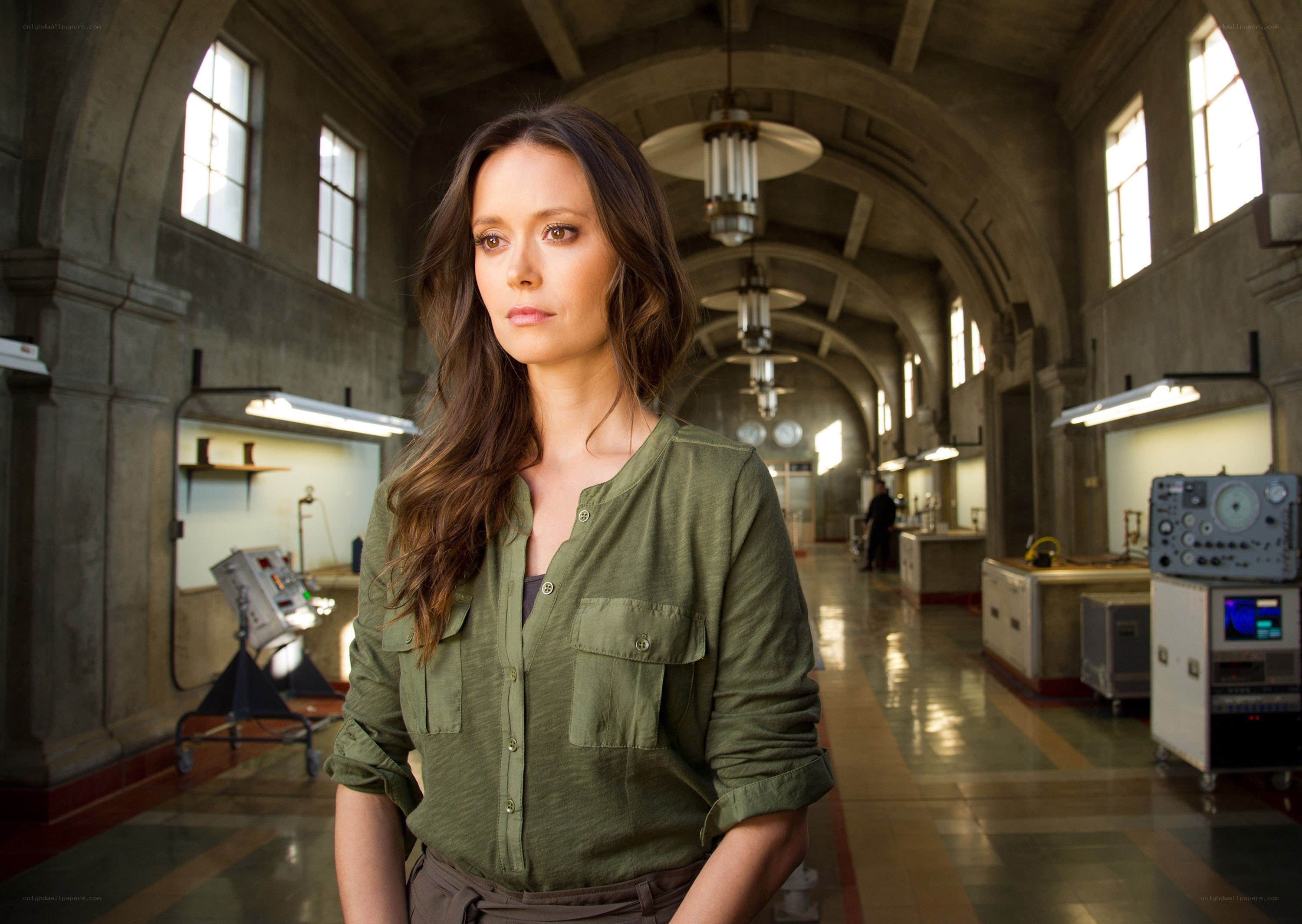Woman in a lab corridor