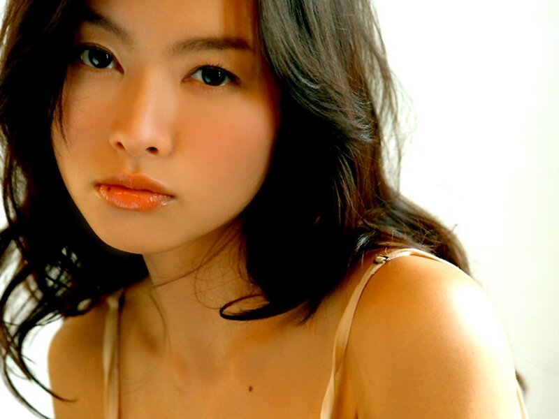 woman in a light-colored top