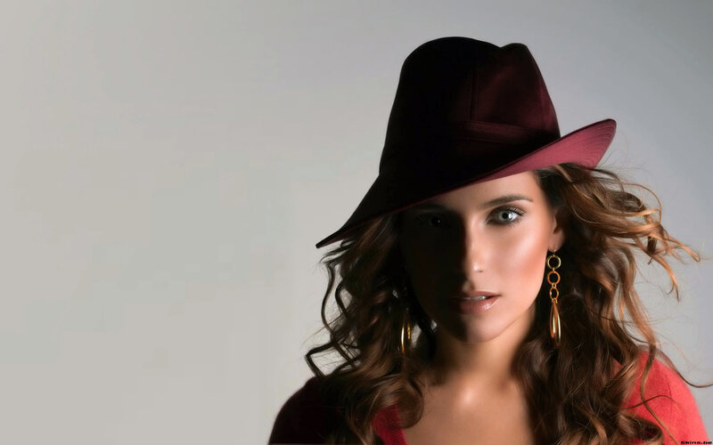 woman in a maroon hat
