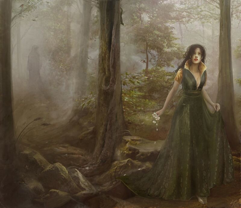 Woman in a misty forest