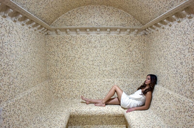 Woman in a mosaic sauna