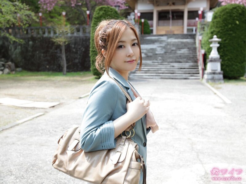 Woman in a park with temple