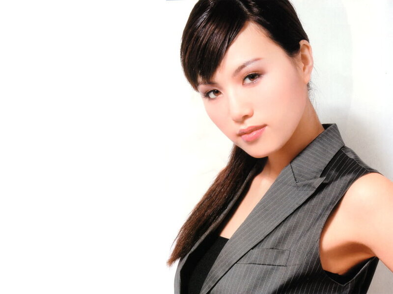 woman in a pinstripe vest
