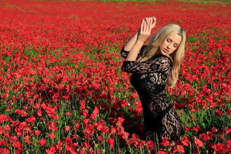 Woman in a poppy field