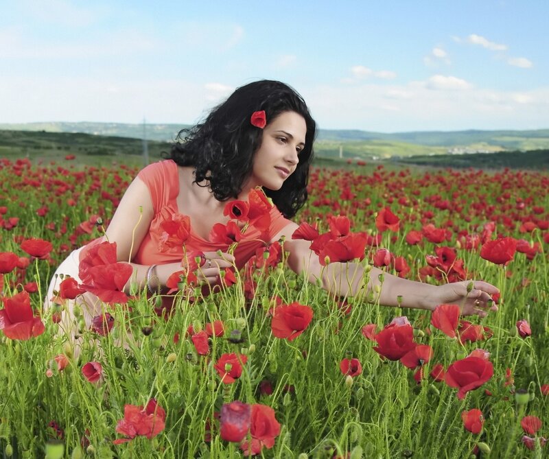 Woman in a poppy field