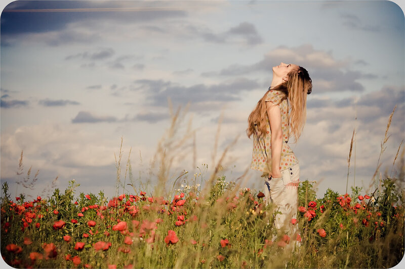 Woman in a poppy field