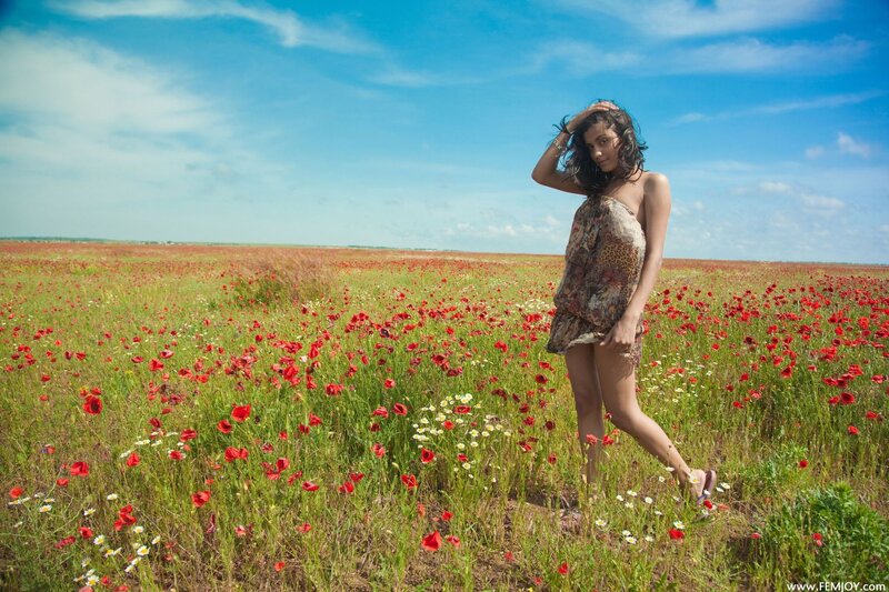 Woman in a poppy field