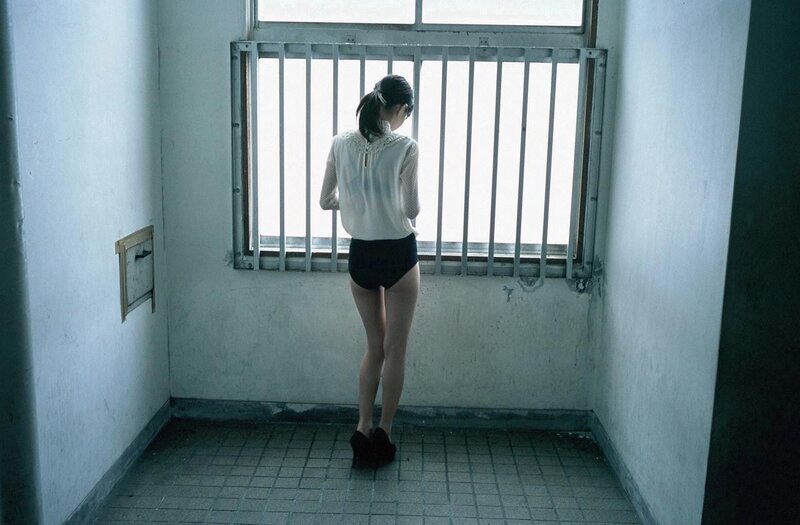 Woman in a prison cell