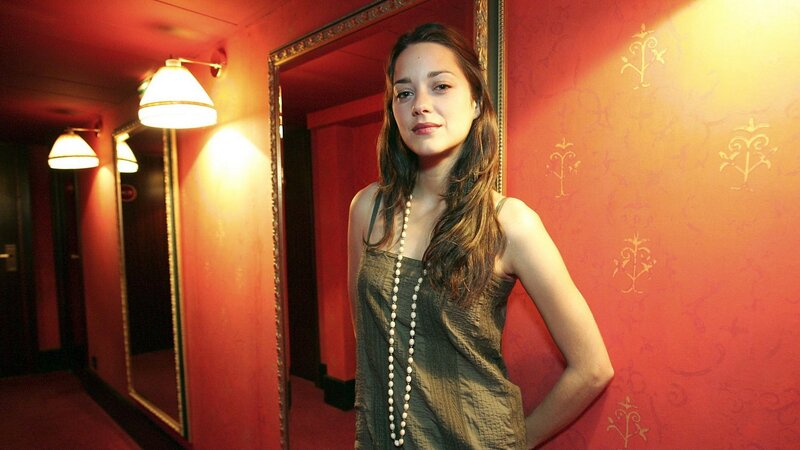 woman in a red hallway