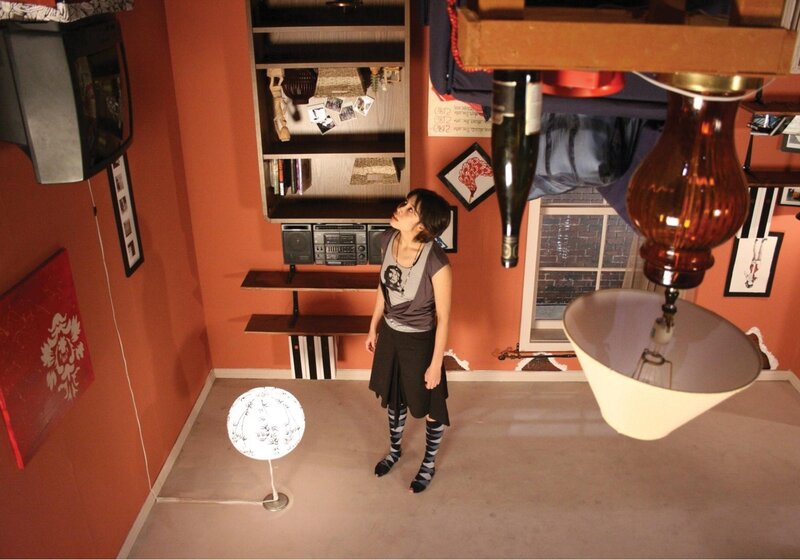 woman in a room with inverted objects