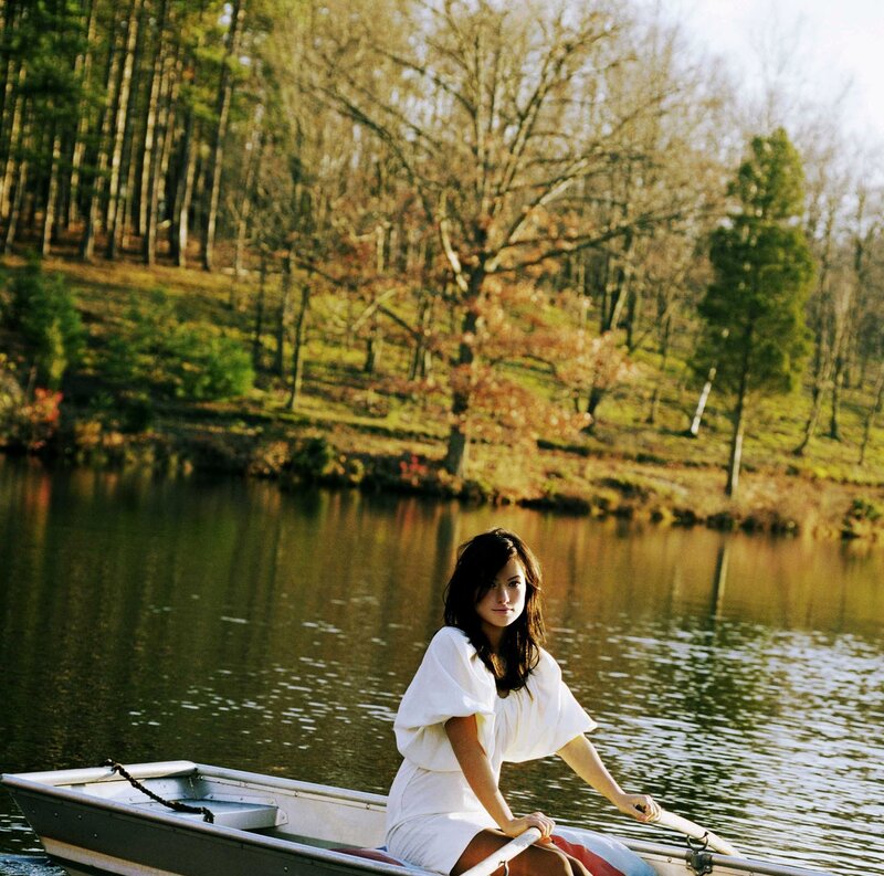 Woman in a rowboat on a lake
