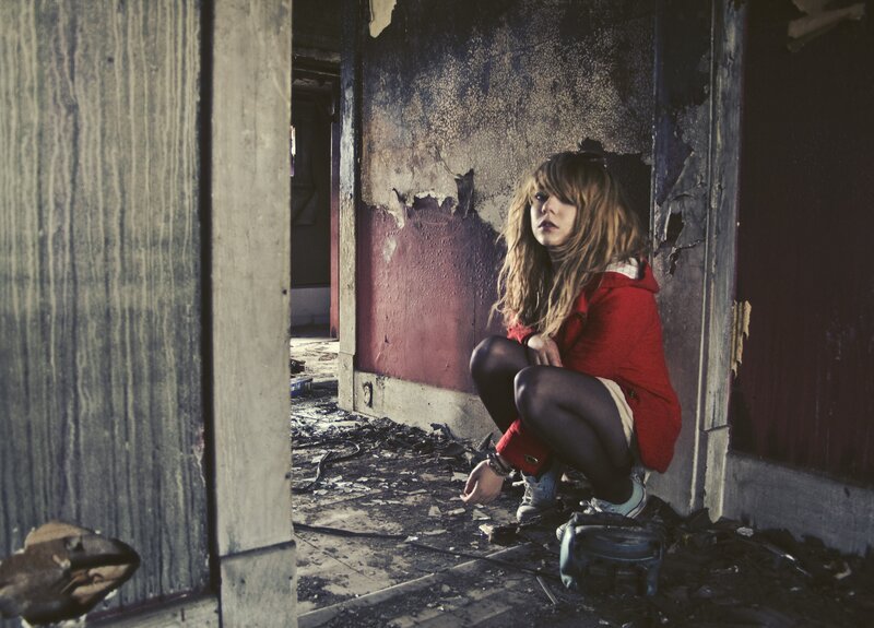 Woman in a ruined building