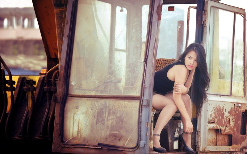 woman in a rusty vehicle