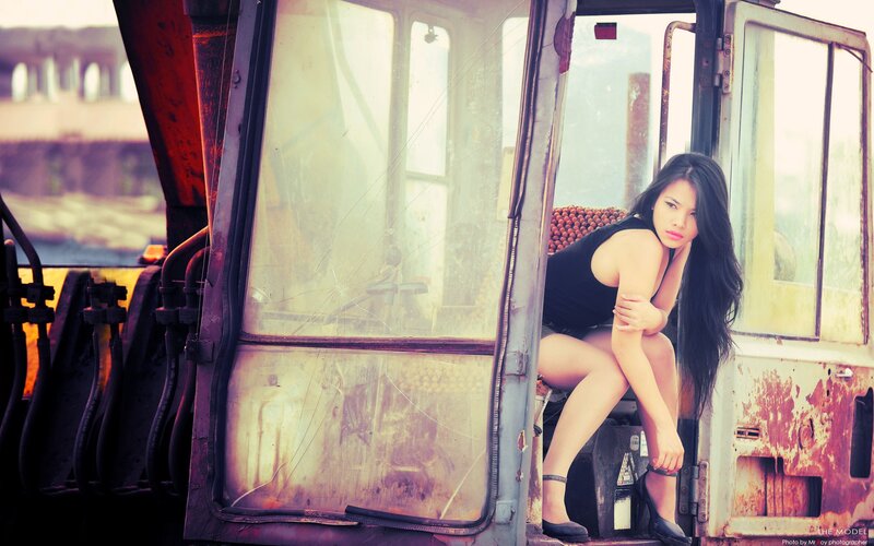 woman in a rusty vehicle
