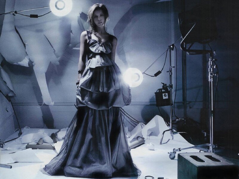 woman in a studio with lighting equipment