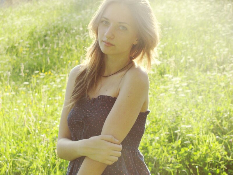 woman in a sunlit field
