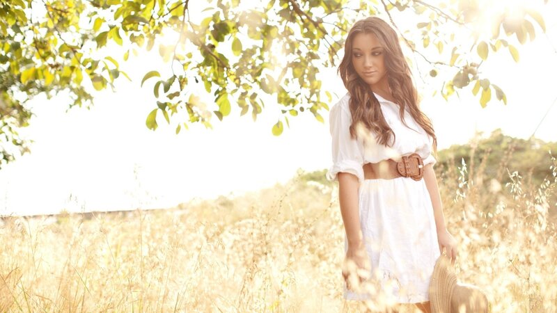 woman in a sunlit field