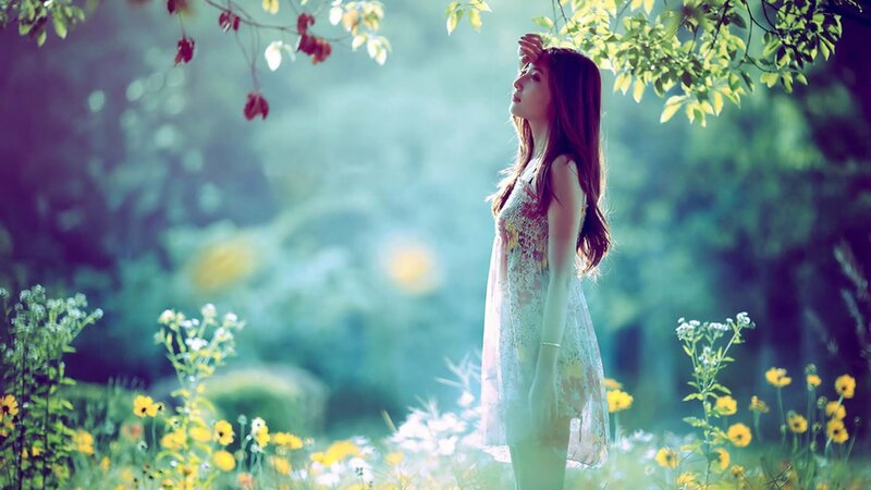 woman in a sunlit garden