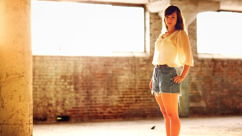 woman in a sunlit warehouse