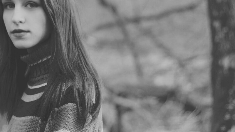 woman in a sweater outdoors