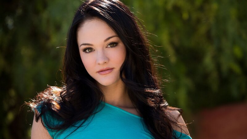 woman in a teal top