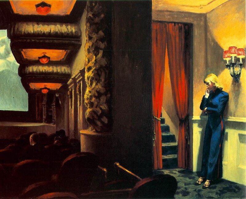 Woman in a theater hallway