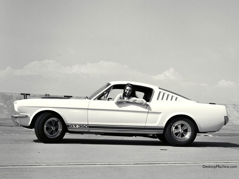 Woman in a white Mustang