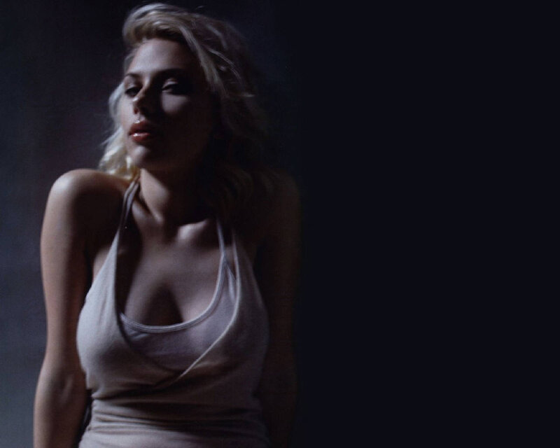 woman in a white tank top