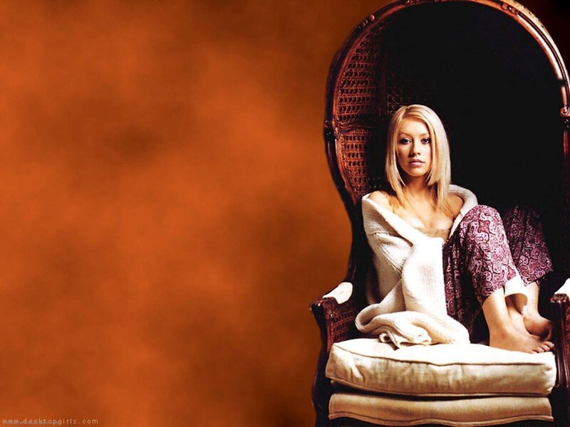 woman in a wicker chair