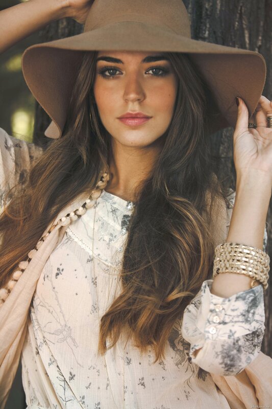 woman in a wide-brimmed hat