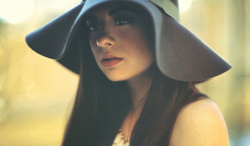 woman in a wide-brimmed hat