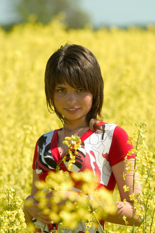 woman in a yellow flower field
