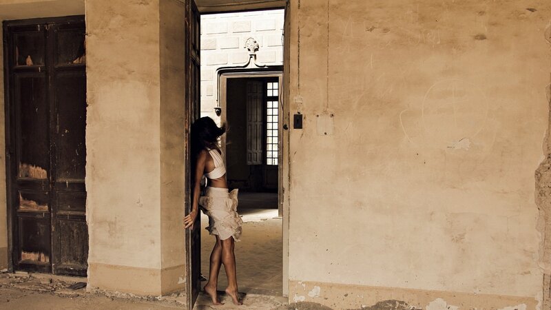 woman in abandoned building