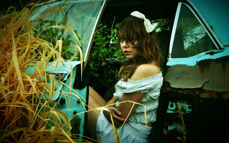 woman in abandoned car