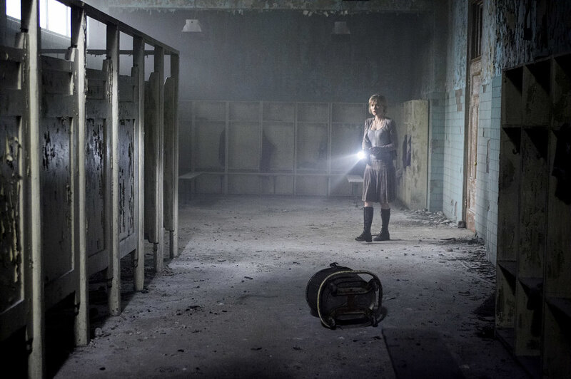 woman in abandoned locker room