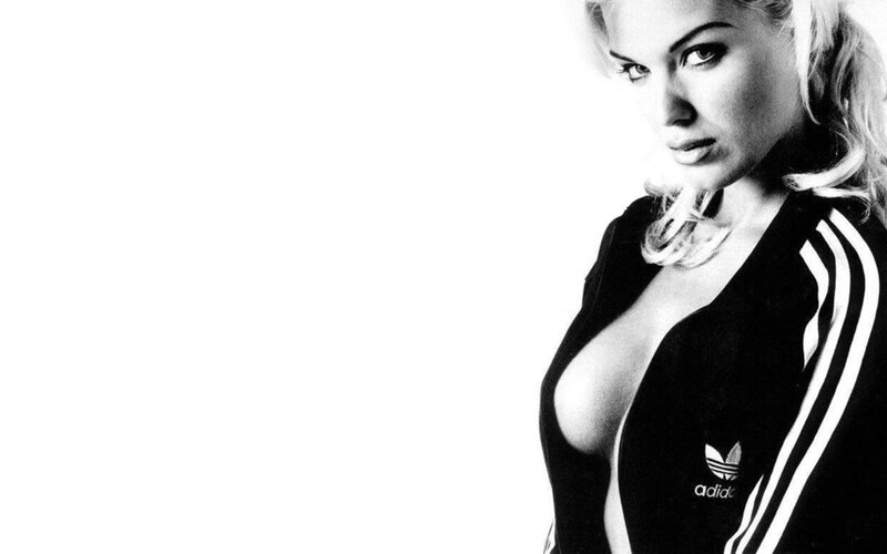 woman in adidas tracksuit