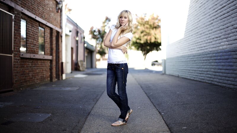 woman in alleyway posing