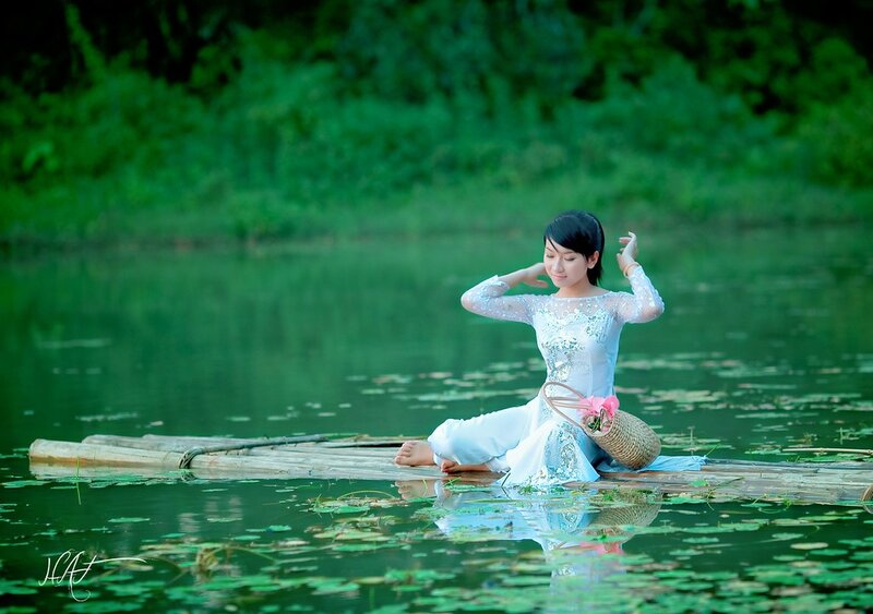 Woman in Ao Dai on Raft
