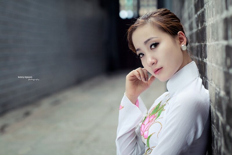 Woman in Ao Dai — White, Contemplative, Photograph