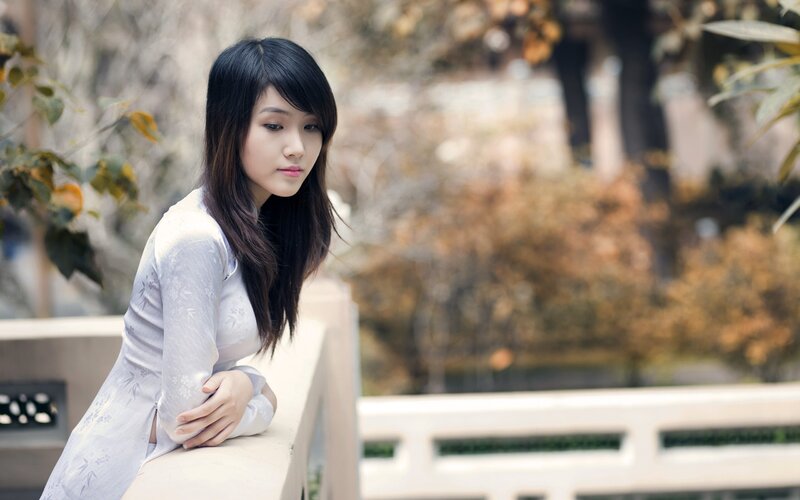 Woman in Ao Dai — White, Contemplative